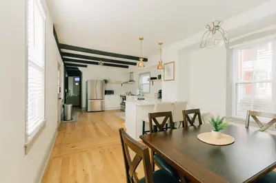 a dining room and kitchen with a table and chairs at Quaint Vintage Reno in Manheim in Manheim