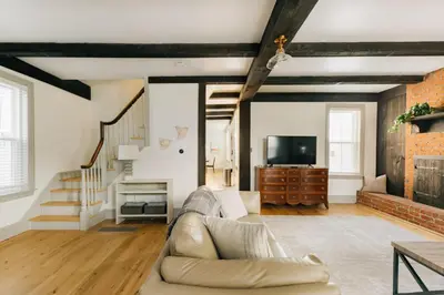 a living room with a couch and a tv at Quaint Vintage Reno in Manheim in Manheim