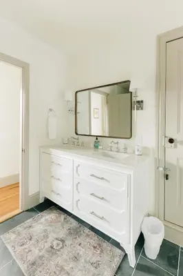 a bathroom with a white sink and a mirror at Quaint Vintage Reno in Manheim in Manheim