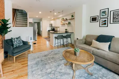 a living room with a couch and a table at Getaway on Grant heart of Downtown with parking in Lancaster