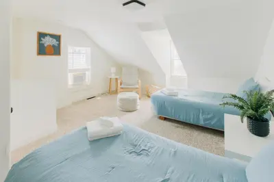 a bedroom with two beds in a attic at Getaway on Grant heart of Downtown with parking in Lancaster