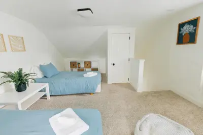 a living room with a bed and a couch at Getaway on Grant heart of Downtown with parking in Lancaster