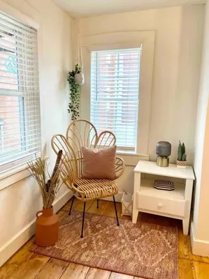 a room with two chairs and a table and windows at Beautiful Boho Villa on Vine in the heart of Lancaster in Lancaster