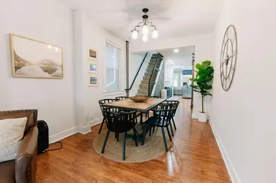 a dining room with a table and chairs at Comfy renovated townhome - heart of Downtown Lancaster in Lancaster