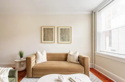 a living room with a couch and a window at Dreamy 2BR in Downtown Princeton in Princeton