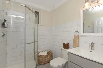 a bathroom with a toilet and a sink and a shower at Dreamy 2BR in Downtown Princeton in Princeton