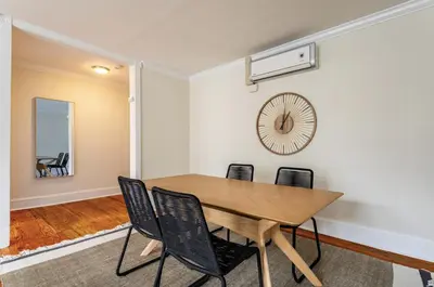 a dining room with a wooden table and chairs at Dreamy 2BR in Downtown Princeton in Princeton