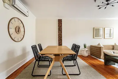 a dining room with a table and chairs at Dreamy 2BR in Downtown Princeton in Princeton