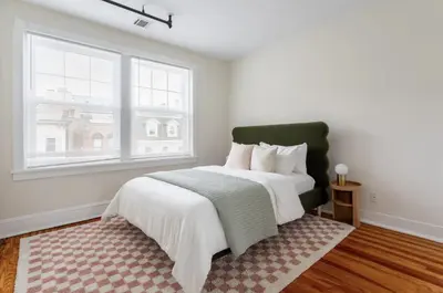 a bedroom with a large bed and a window at Fun & Funky 2BR in Downtown Princeton in Princeton