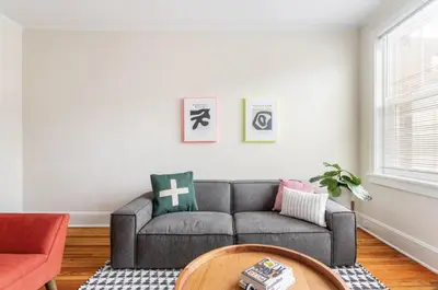 a living room with a couch and a table at Fun & Funky 2BR in Downtown Princeton in Princeton