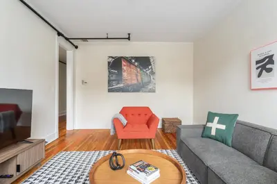 a living room with a couch and a table at Fun & Funky 2BR in Downtown Princeton in Princeton