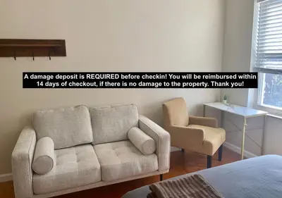 a living room with a couch and a chair at Historic Townhouse Oasis with En-suite Bathroom in Philadelphia