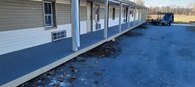 a side of a building with a side walk at Scottish Inns - Middletown in Middletown
