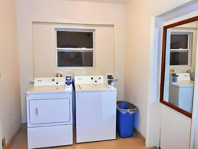 a laundry room with a washer and dryer at Scottish Inns - Middletown in Middletown