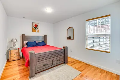 a bedroom with a large bed and a window at Modern Elizabeth Apartment about 1 Mi to Train Station in Elizabeth