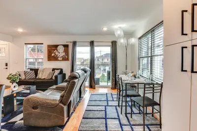 a living room with a couch and a table at Modern Elizabeth Apartment about 1 Mi to Train Station in Elizabeth