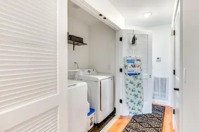 a white laundry room with a washer and dryer at Modern Elizabeth Apartment about 1 Mi to Train Station in Elizabeth