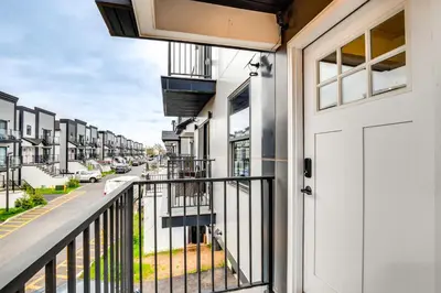 a balcony with a white door and a street at Modern Elizabeth Apartment about 1 Mi to Train Station in Elizabeth