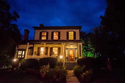 a house with its lights on at night at The Borland House Inn in Montgomery