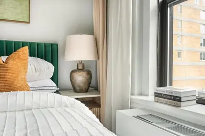 a bedroom with a bed and a window at 73-919 New Studio UWS Doorman Gym in New York