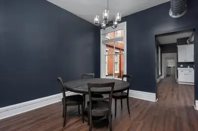 a dining room with a table and chairs at Flats on Front - Riverfront Gem Fast Wi-Fi 2F in Harrisburg