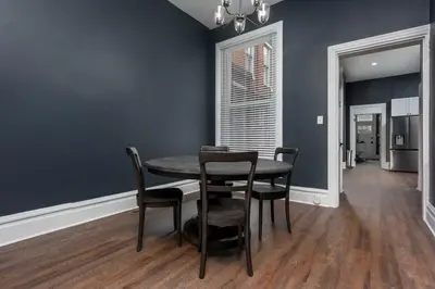 a dining room with a table and chairs at Flats on Front - Riverfront Gem Fast Wi-Fi 1F in Harrisburg