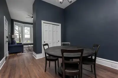 a dining room with a table and chairs at Flats on Front - Riverfront Gem Fast Wi-Fi 1F in Harrisburg