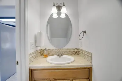 a bathroom with a sink and a mirror at 30 Day Minimum Stay - Private Creekside Solace in East Stroudsburg