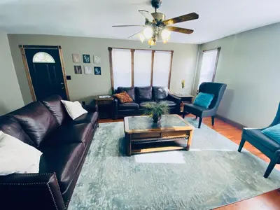 a living room with a leather couch and a coffee table at StoneBrook Haven near Guthrie RPH Towanda Campus in Ulster