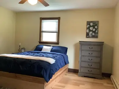 a bedroom with a bed and a dresser at StoneBrook Haven near Guthrie RPH Towanda Campus in Ulster