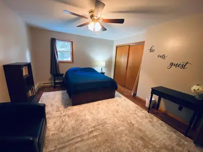 a bedroom with a bed and a ceiling fan at StoneBrook Haven near Guthrie RPH Towanda Campus in Ulster