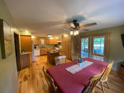 a kitchen and dining room with a table and chairs at StoneBrook Haven near Guthrie RPH Towanda Campus in Ulster