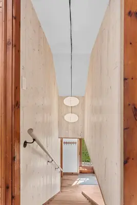 a large concrete wall in a hallway with a staircase at Chambers Hollow in Walton
