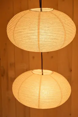 two white lights hanging from a wall at Chambers Hollow in Walton