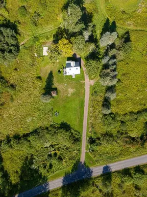 an aerial view of a house and a road at Chambers Hollow in Walton