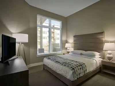 a bedroom with a bed and a window and a television at AVE Florham Park - Furnished Apartment, Florham Park NJ in Florham Park