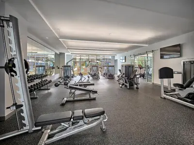 a gym with a lot of treadmills and machines at AVE Florham Park - Furnished Apartment, Florham Park NJ in Florham Park