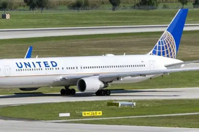 an united airplane is sitting on a runway at CLINTON HILLS - Newark in Newark