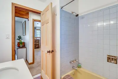 a bathroom with a sink and a bath tub at Lovely Tobyhanna Getaway with Game Room and Fire Pit! in Tobyhanna