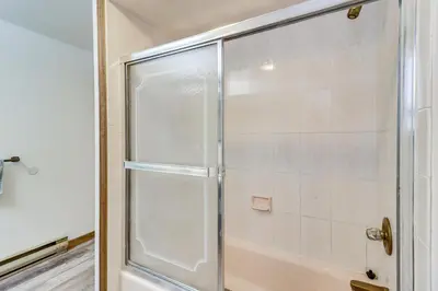 a shower with a glass door in a bathroom at Lovely Tobyhanna Getaway with Game Room and Fire Pit! in Tobyhanna