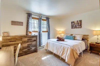 a bedroom with a bed and a dresser and a window at Lovely Tobyhanna Getaway with Game Room and Fire Pit! in Tobyhanna
