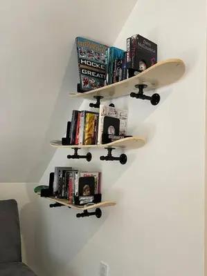 two shelves with books and a skateboard on a wall at Casa di Montagna/5BR/3Bath/NearResorts/PetsAllowed in Pocono Lake