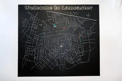 a chalk map of the city on a chalkboard at Larry's Lancaster Landing: with fully-fenced yard in Lancaster