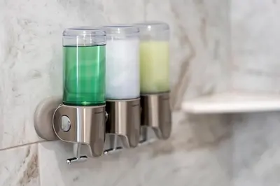 a food processor on a wall with two drinks in it at Big City Living: Elegant Apartment with NYC Vibes in Jersey City