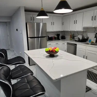 a kitchen with a bowl of fruit on a counter at The Luxurious loft in Newark