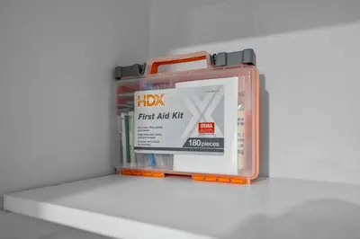a container of first aid kits sitting on a shelf at The Luxurious loft in Newark