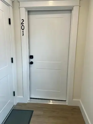 a white door with the number on it at Montgomery Modern Luxury Stays in Montgomery