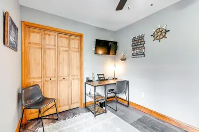 a home office with a desk and two chairs at Pocono Lake House Hideaway Hot Tub and Theater Room in Pocono Lake
