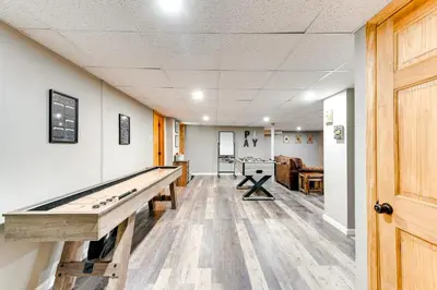 a hallway with a ping pong table in a room at Pocono Lake House Hideaway Hot Tub and Theater Room in Pocono Lake