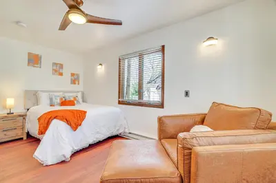 a bedroom with a bed and a couch at Spacious Retreat 7 Mi to Tobyhanna State Park! in Tobyhanna